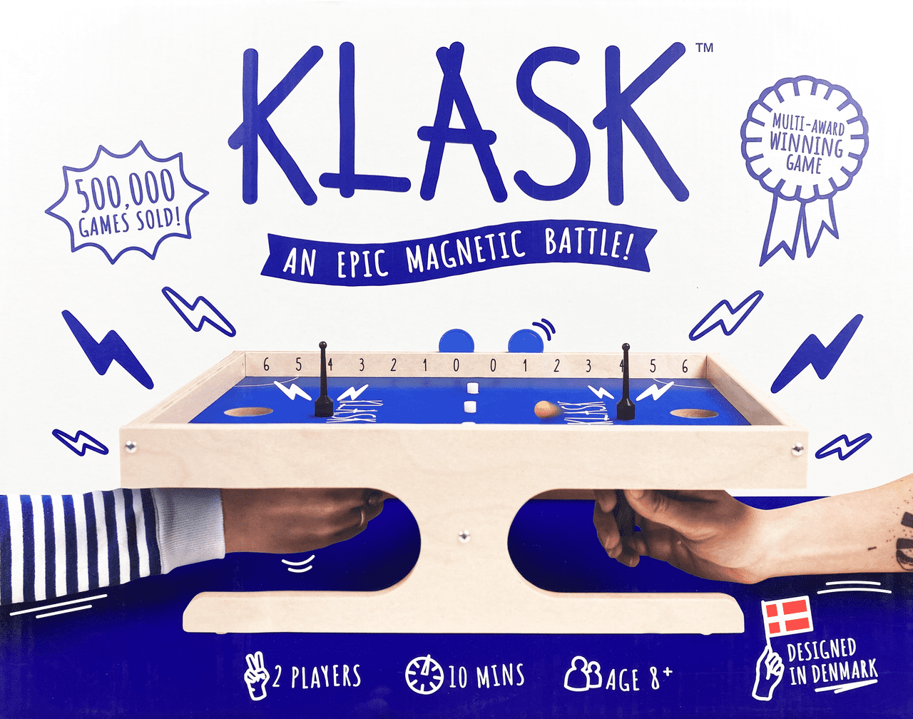 Klask game packaging with magnetic battle design, branding, and product details.