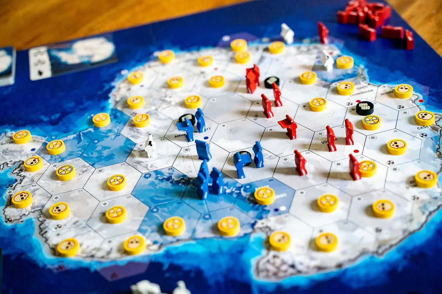 Board game with colorful pieces on a map-like board