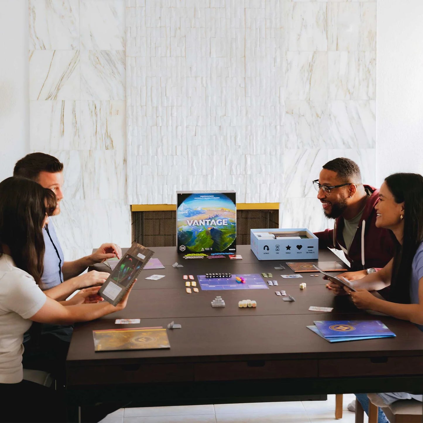 Group of people playing a board game in a modern indoor setting