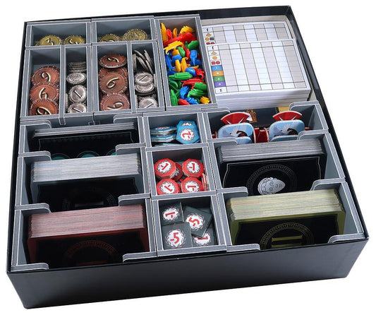Board game organizer with compartments for various game pieces on a white background