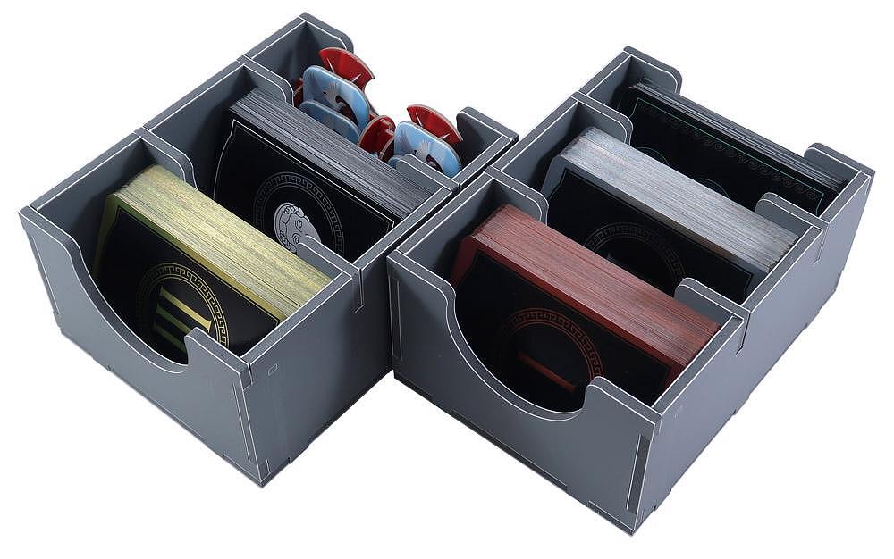 Gray organizer with compartments holding various items on a white background
