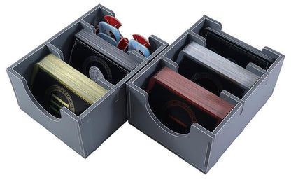Gray organizer with compartments holding various items on a white background