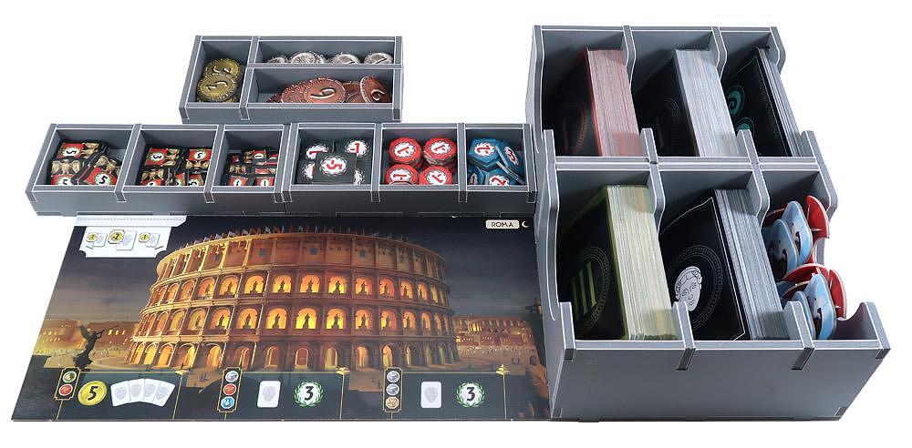 Board game organizer with compartments filled with game pieces and a Colosseum-themed board.