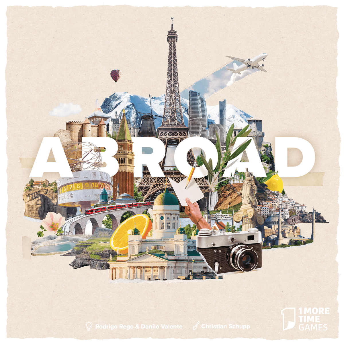 Collage-style travel poster artwork with the word “ABROAD” across the center, featuring landmarks and travel motifs including the Eiffel Tower, airplane, camera, camera lens, buildings, fruit, and a hand holding a pen on a beige textured background. Small text at the bottom reads “Robbie Rops & Danilo Valente” and “Christian Schupp,” with a “1 More Time Games” logo in the lower right.