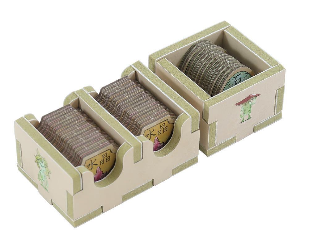 Tea bags in a wooden organizer on a white background