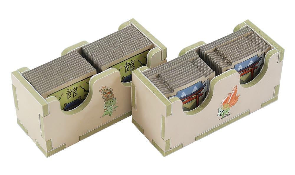 Two wooden tea box organizers with compartments for tea bags on a white background