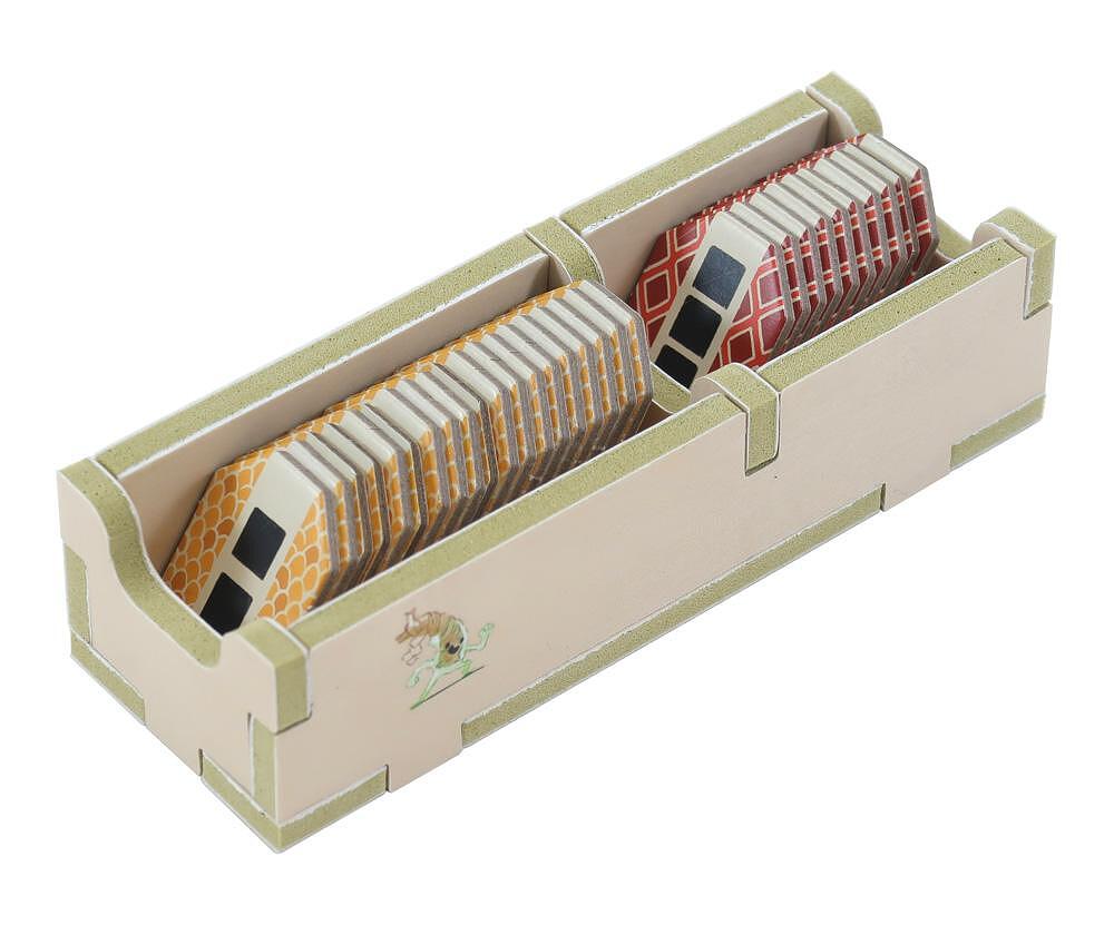 Cardboard organizer with compartments holding cards on a white background