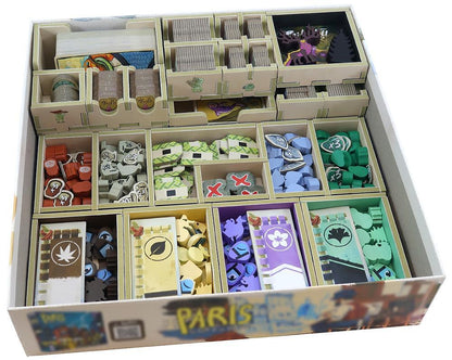 Board game box with compartments containing various game pieces and cards.