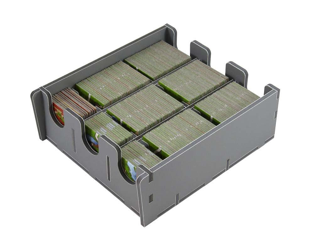Gray card storage box with green cards on a white background