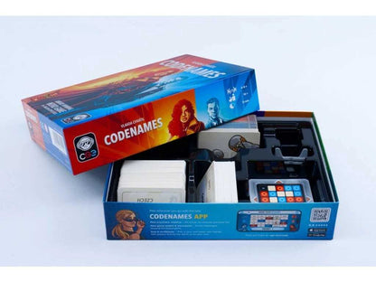 Open box of Codenames game with colorful packaging on a white background