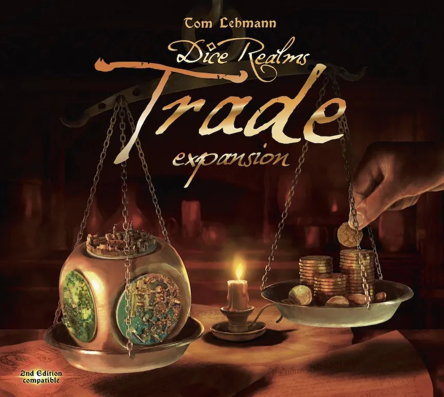 Game expansion box for 'Dice Realms Trade' with scales and coins on a table.