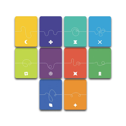 Colorful card game pieces with symbols on a white background