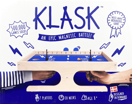 Klask game packaging with magnetic battle design, branding, and product details.
