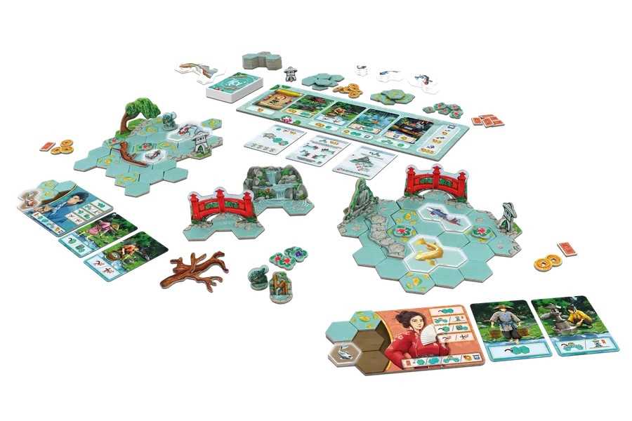 Board game set with various pieces and cards on a white background