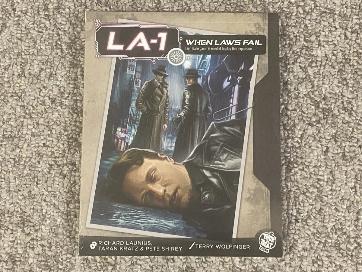 Board game box titled 'LA-1 When Laws Fail' on a textured surface