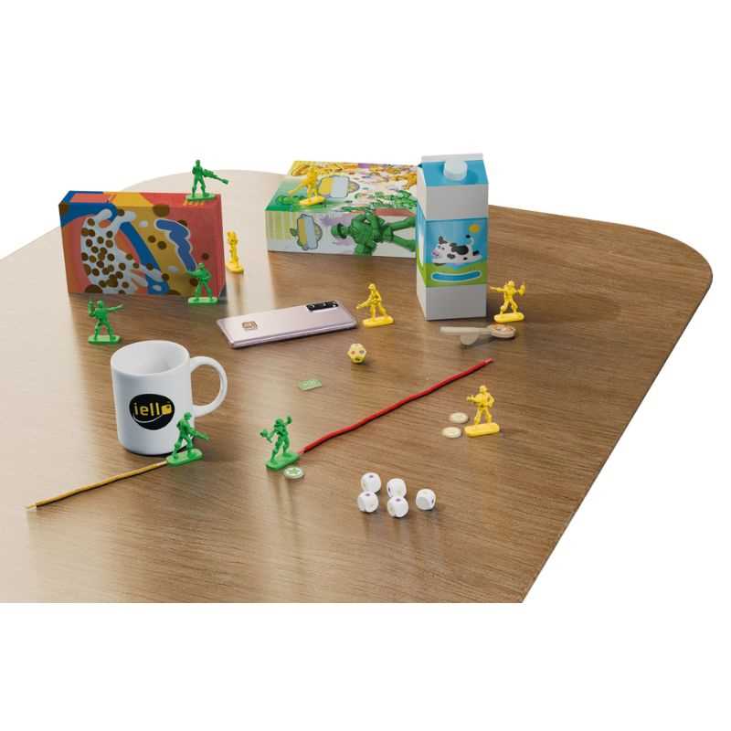 Tabletop game setup with miniatures, a mug, and other items on a wooden surface.