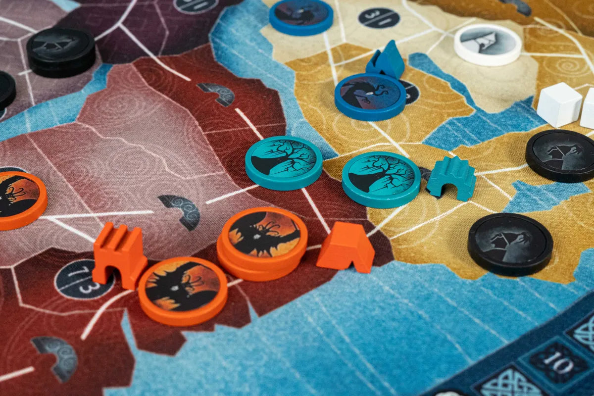 Board game pieces on a colorful board with various shapes and colors.
