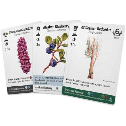 Three card packs from a board game, each with plant illustrations and text.