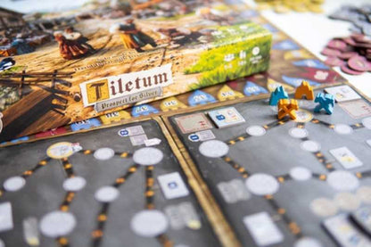 Board game with 'Tiletum' box and game pieces on a table