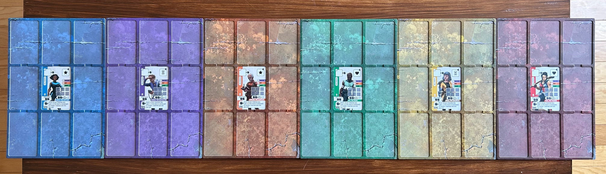 Grid of colorful card holders with cards inside on a wooden surface