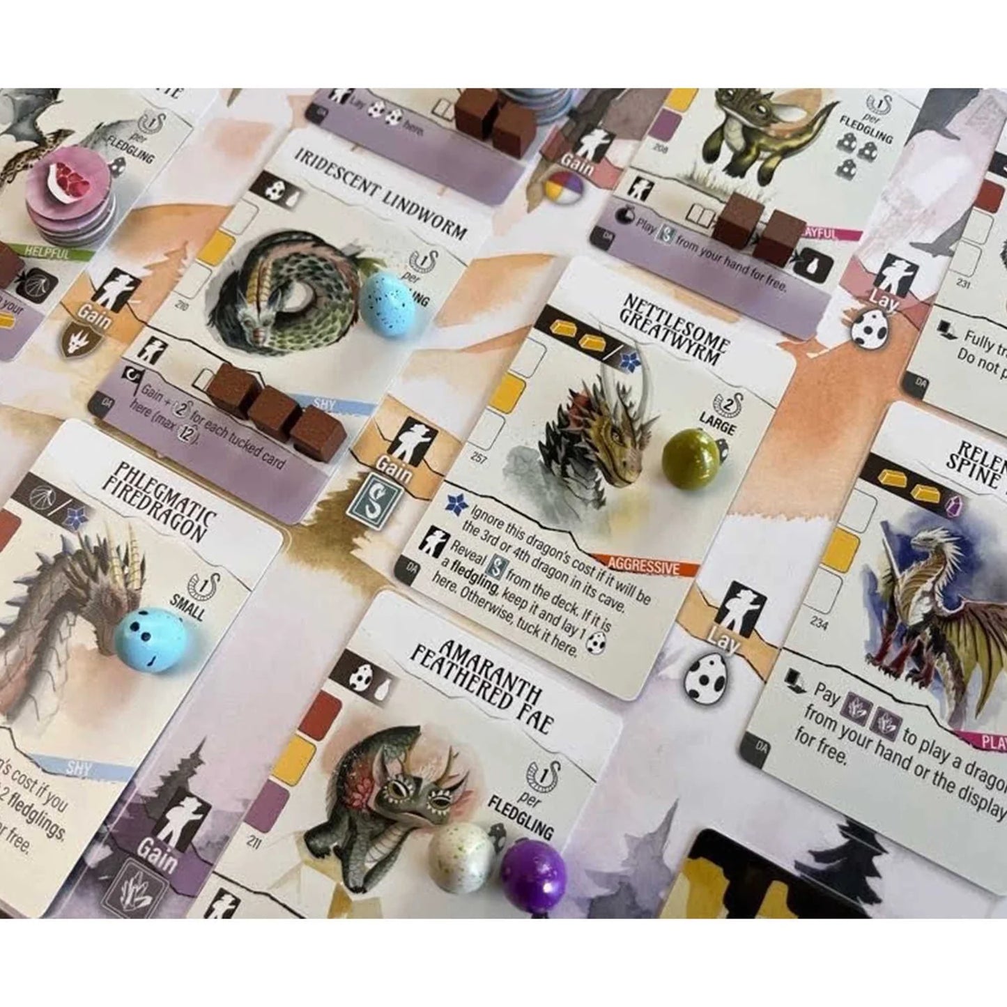 Collection of fantasy game cards with various creatures and text on a white background