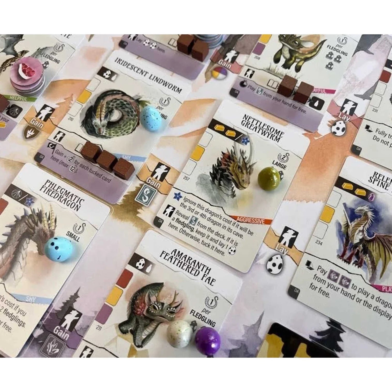 Collection of fantasy game cards with various creatures and text on a white background