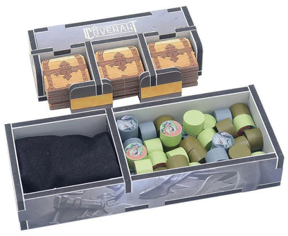 Cardboard organizer with compartments for cards and dice, featuring the brand 'Ravensburger'.