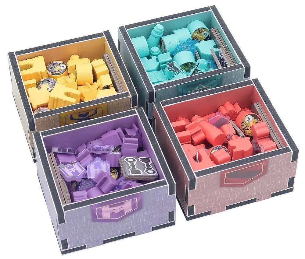 Four colorful storage boxes with various small items inside on a white background