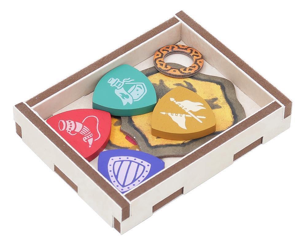 Set of colorful guitar picks with designs in a box on a white background