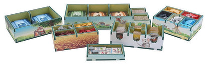 Set of card game boxes with various designs on a white background