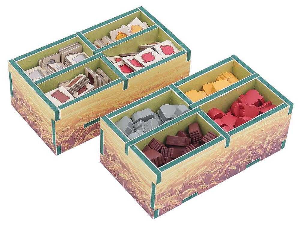 Two wooden compartmentalized boxes with colorful contents on a white background