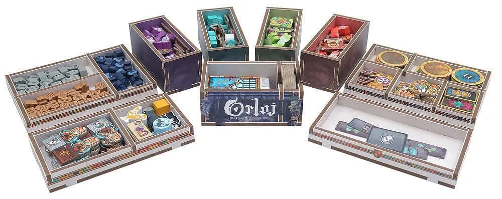 Collection of board game boxes with various designs and colors on a white background