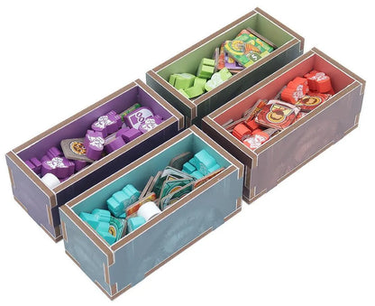 Four colorful storage boxes with compartments filled with various items on a white background