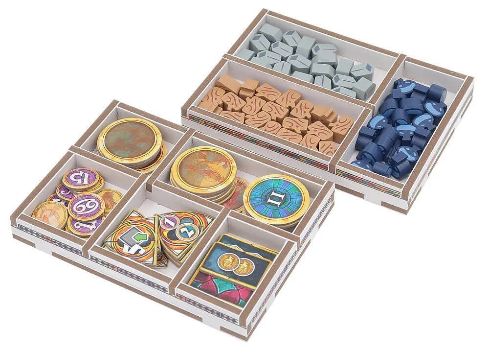 Colorful game pieces in a wooden box on a white background