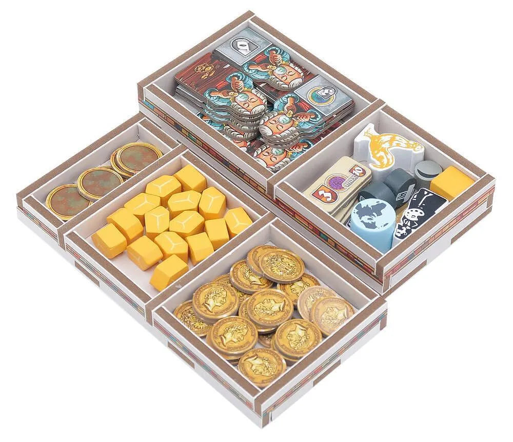Cardboard compartmentalized organizer with compartments filled with various items on a white background