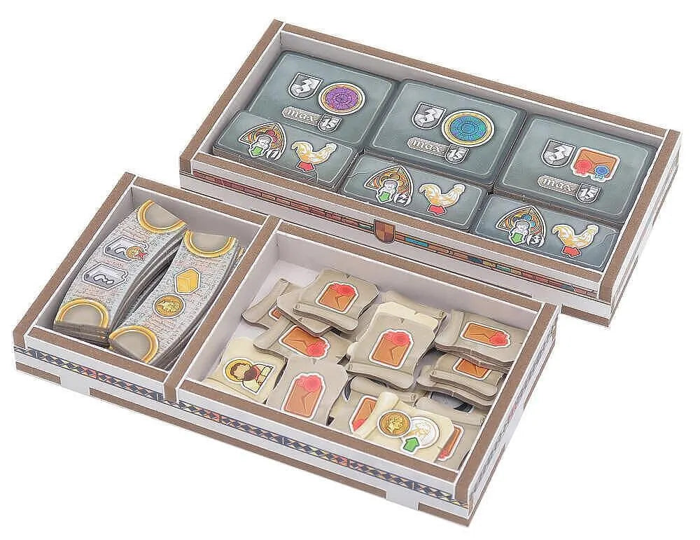 Set of wooden stamps with colorful designs in a box on a white background