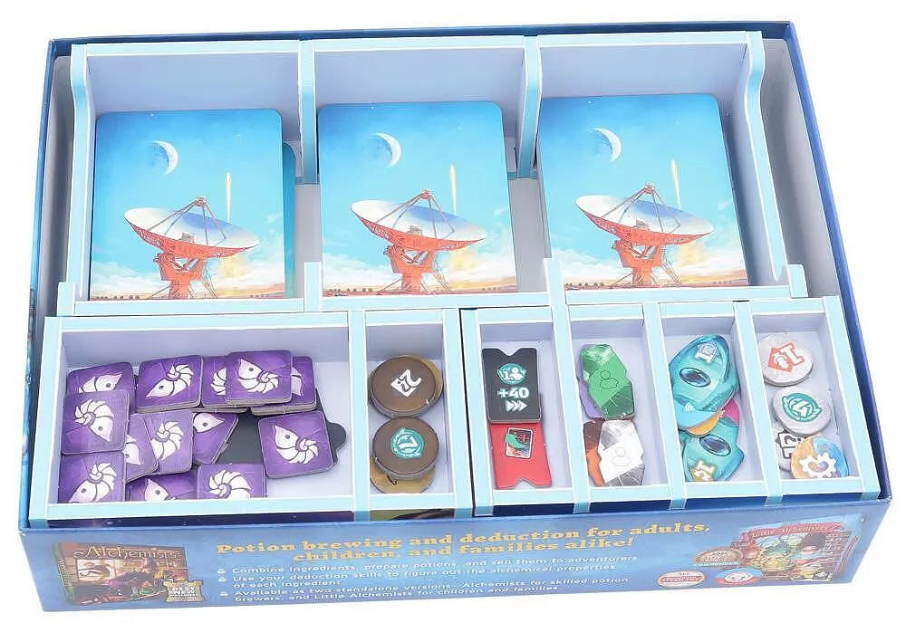 Board game components including cards and dice in a blue box