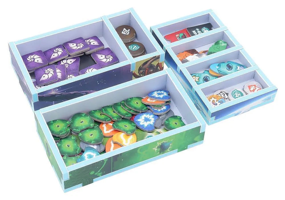 Card game organizer with compartments containing cards and tokens on a white background