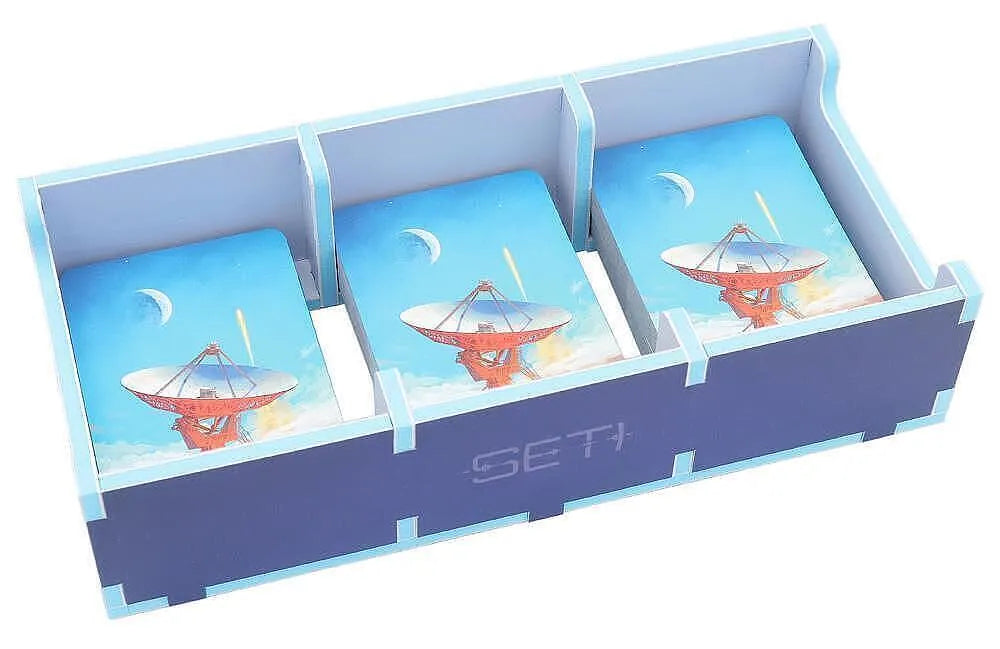 Set of three cards with space-themed designs in a blue holder labeled 'SETI'.