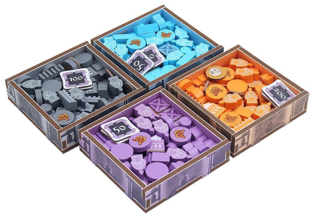 Four cardboard boxes containing colorful wooden pieces with symbols on a white background